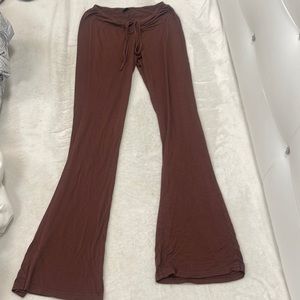 Brown flare leggings. Goes in at lower stomach for a snatched look.